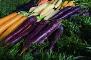 multi coloured carrots stacked on top of one another